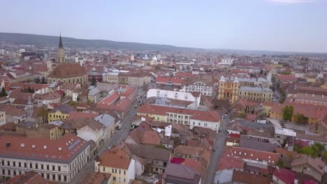 Drone-shot-flying-above-the-center-of-Cluj-in-Romania-on-a-sunny-day