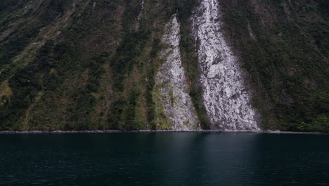 exposed slope of fjord after landslide and tree avalanche, milford sound