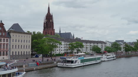 view on river main with ships and old town in the background