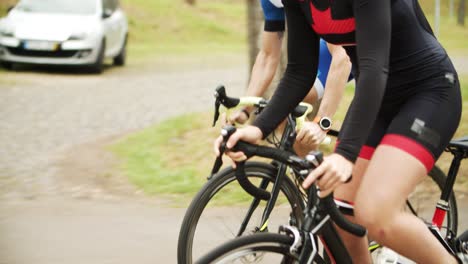 focused athletes riding bicycles