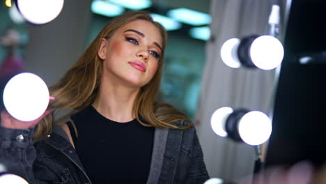 woman getting ready in makeup studio