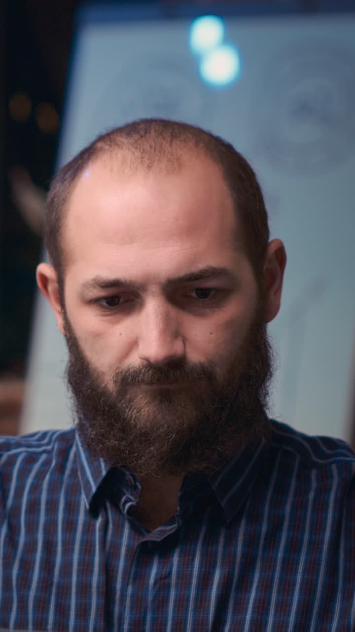 Vertical video: Company worker looking at camera in business meeting, smiling