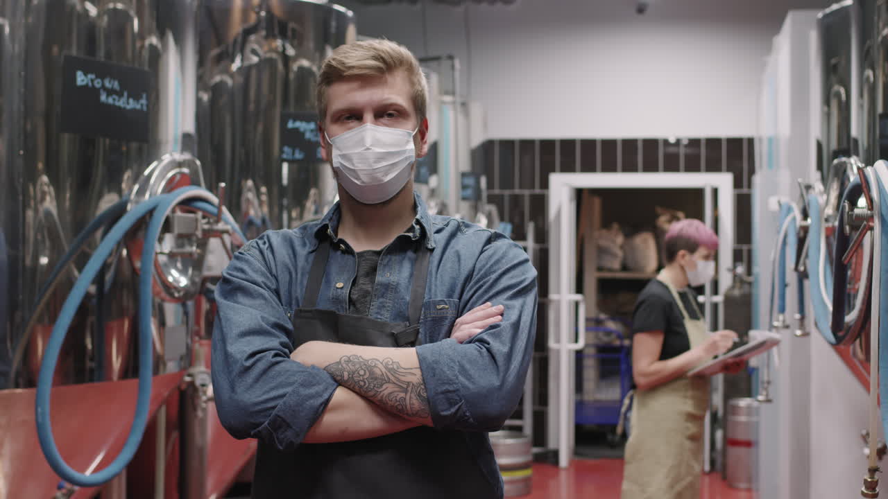 Portrait Of Brutal Brewery Worker In Mask