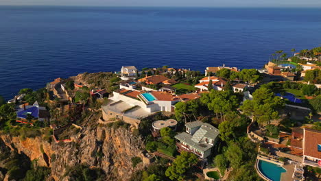 drone view of luxurious villas at playa marina del este, spain