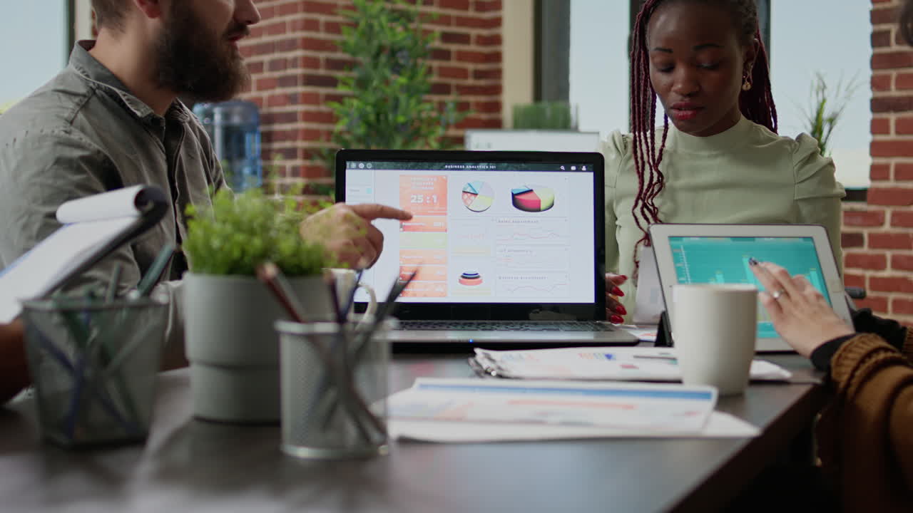 Diverse team of business people working on research report