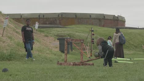 catapult demonstrated at a renaissance fair, philadelphia renaissance fair, fort mifflin, pennsylvania