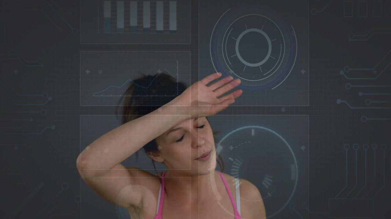 Female teen breathing, wiping forehead recovering breath, HUD overlaying charts on dark backdrop