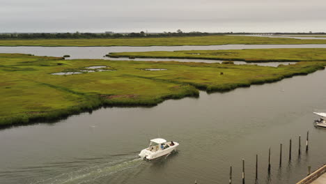 an aerial view of a fishing boat sailing in freeport, ny