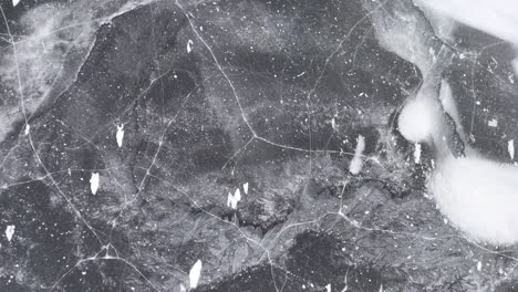 flying a drone over a frozen wisconsin lake reveals many different shapes and designs.