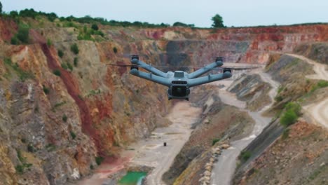 advanced unmanned aircraft ascend over limestone quarry, czech republic