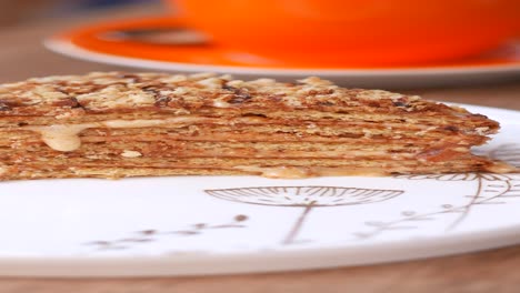 slice of layered cake with orange cup