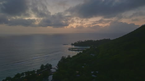 early morning aerial drone shot of silhouette island in the seychelles