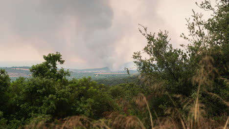 Wildfire-Timelapse-Smoke-Large-Brush-Fire-wide-Shot-pan-left-Greece-Summer