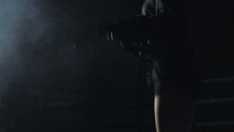 athlete engaged in jump rope training in a dimly lit environment