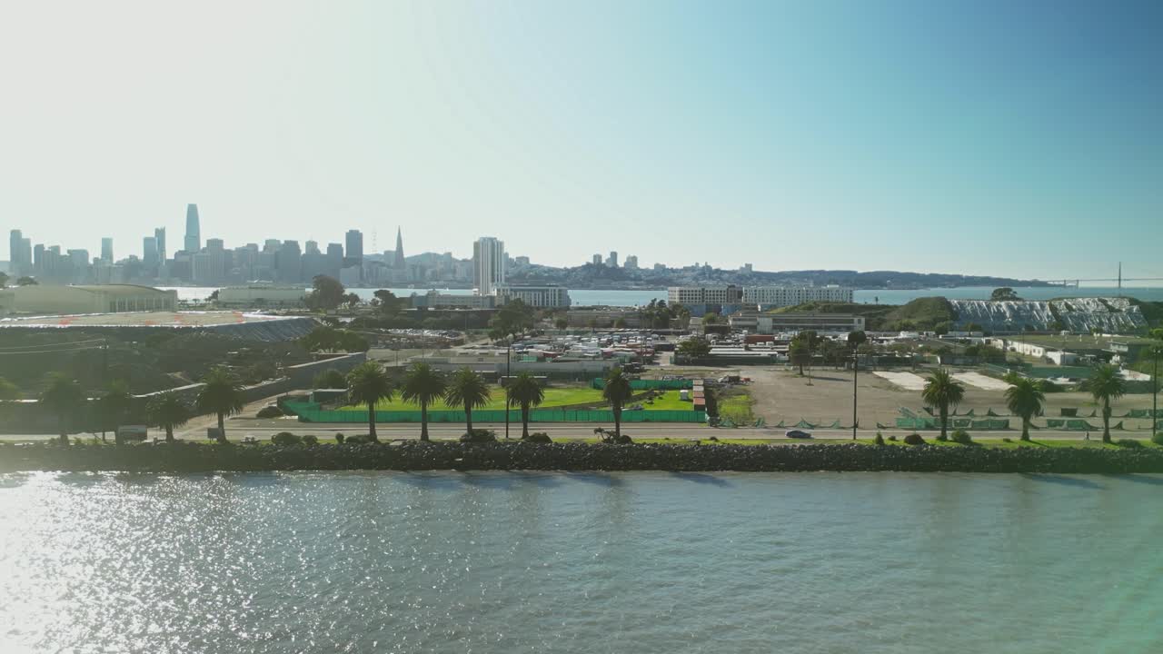 Breathtaking dolly zoom out from a drone of Treasure Island’s coastal beauty and city proximity.