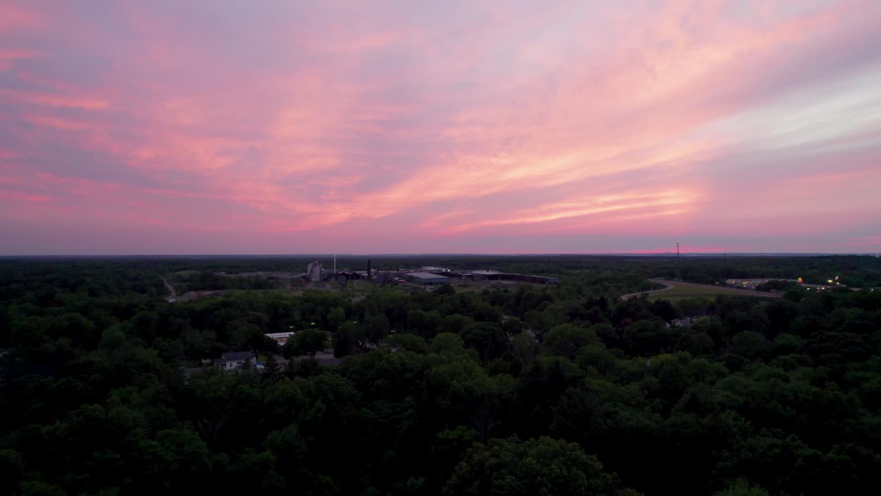 A real amazing panoramic view of a beautiful pink sky at sunset time with gentle colorful clouds