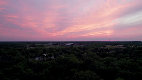 a real amazing panoramic view of a beautiful pink sky at sunset time with gentle colorful clouds
