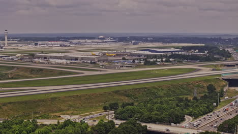 Atlanta-Georgia-Aerial-v942-drone-flyover-College-Park-capturing-interstate-285-traffic,-Hapeville-South-Cargo-and-ATL-Hartsfield-Airport-with-cityscape-skyline---Shot-with-Mavic-3-Pro-Cine---May-2023