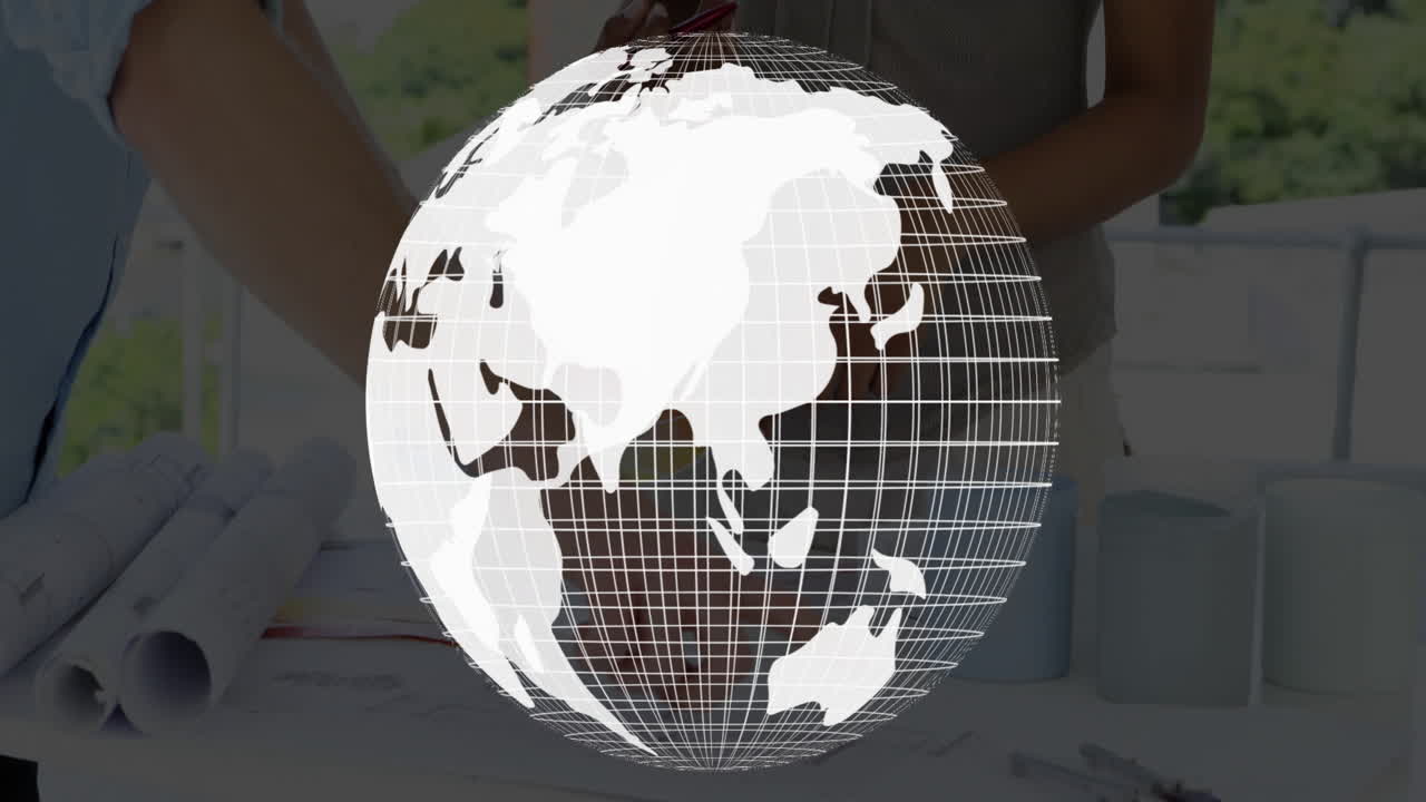 White globe grid animation over people working with documents at table