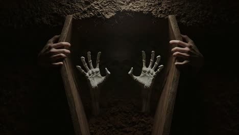 a haunting emergence from darkness: hands grasping for freedom through the depths of isolation and fear in an eerie grave-like environment