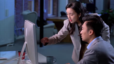 cooperation, computer screen and team in discussion in office while working on project together. teamwork, technology and business people discussion and researching for report on computer in workplace