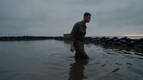 soldier navigating floodwaters