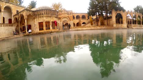 ethnic shop in courtyard of balikligol pool of sacred fish winter view sanliurfa