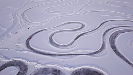 aerial view of a snowmobile track on a frozen lake