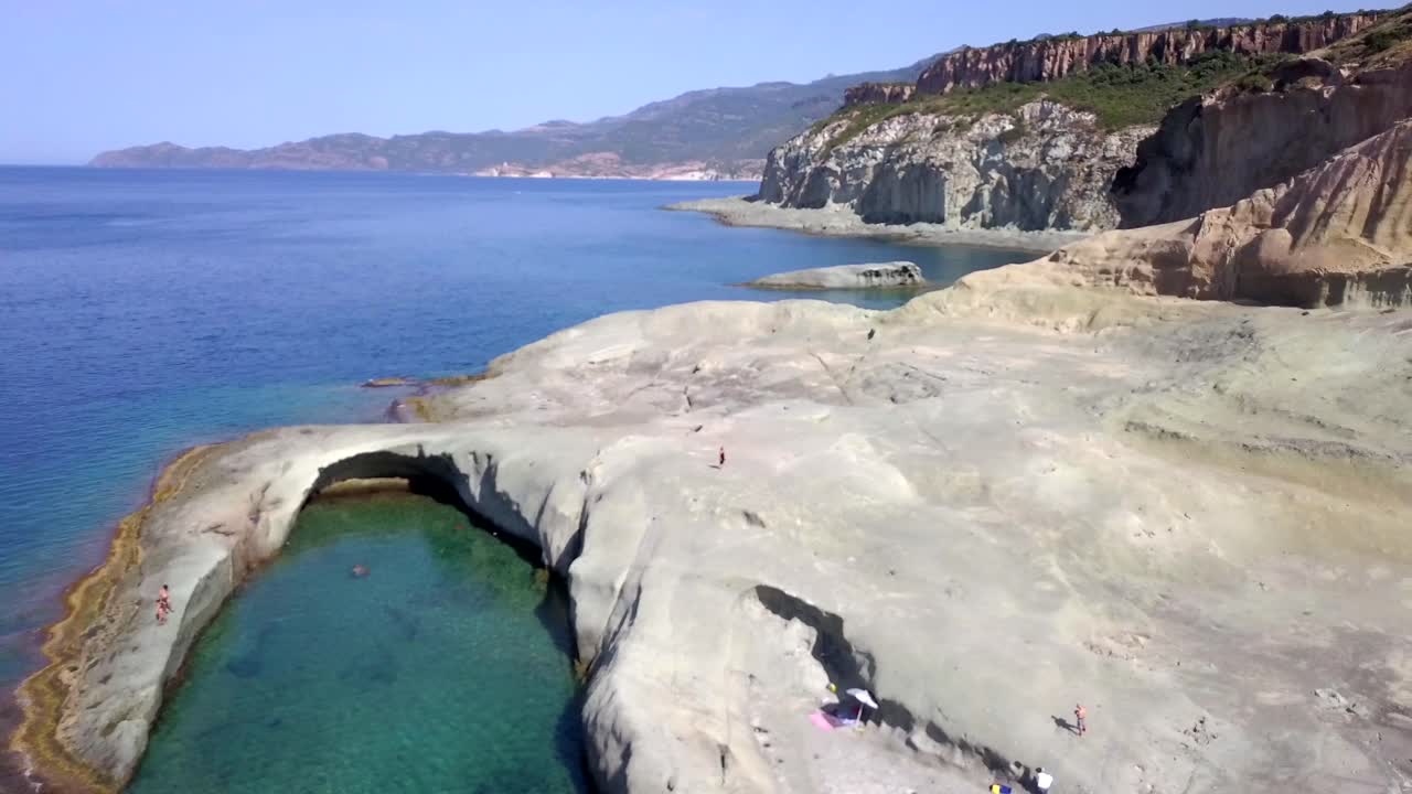 Drone Aerial shot of the natural swimming pool of Cane Malu in Sardinia, Italy. A wonderful typical mediterranean coastal landscape. Pedestal up movement