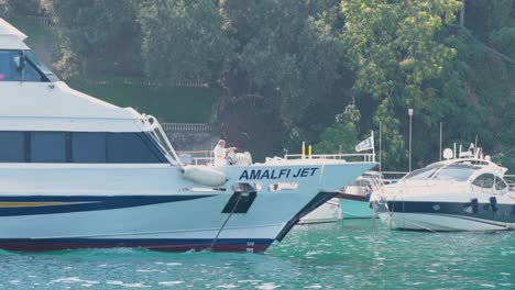 a boat anchors in sorrento, naples, italy