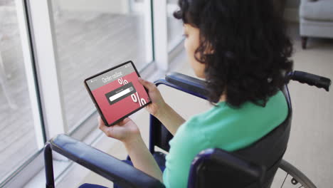 Biracial-woman-in-wheelchair-using-tablet,-online-shopping-during-sale,-slow-motion