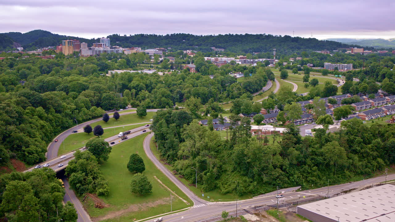Slow motion drone shot revealing Asheville, North Carolina’s urban horizon