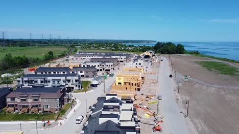 new home construction near farmland community housing development along shoreline