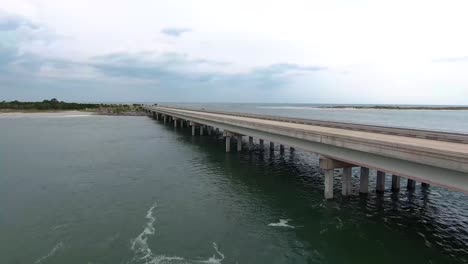 AERIAL:-Rise-up-to-reveal-the-Florida-highway-sitting-on-the-coast-next-to-the-ocean