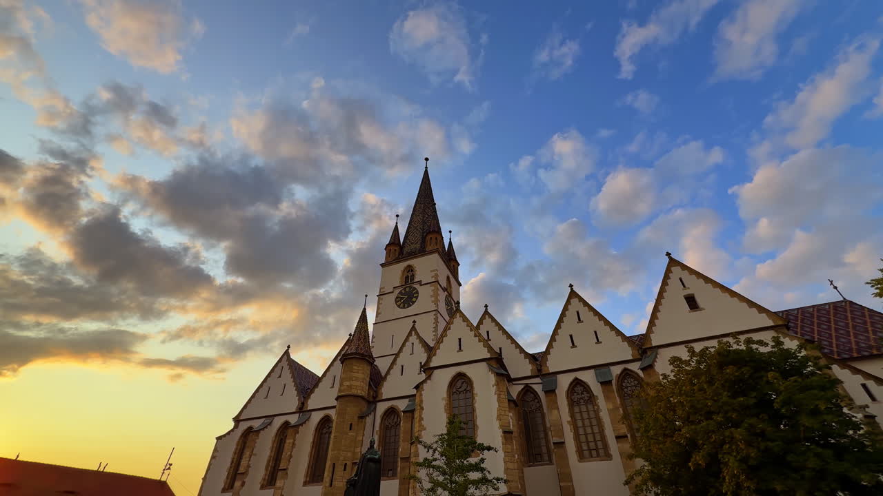 Sibiu, Romania, 1 July 2025: Lutheran Cathedral of Sibiu at Sunset. The Gothic Lutheran Cathedral in Sibiu, Romania, photographed at sunset with dramatic clouds in the background