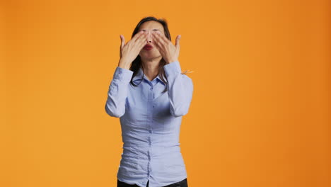 flirty asian person blowing air kisses in studio