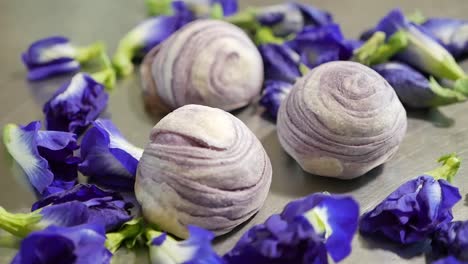 purple chinese pastry with butterfly pea flower, close up-1