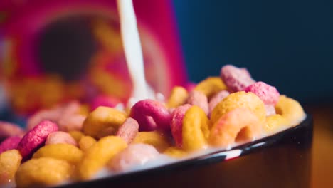 breakfast cereals in a bowl with milk in slomotion