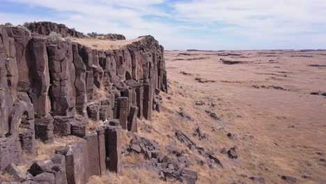 aerial rotates along ancient weathered basalt columns in central wa