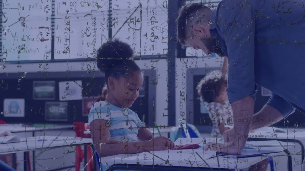 Teacher reaching for workbook, guiding student writing and math while equations overlay persists
