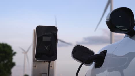 Progressive-combination-of-EV-car,-charging-station-and-wind-turbine.