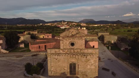 front exterior facade of tratalias old historical church in south sardinia, aerial