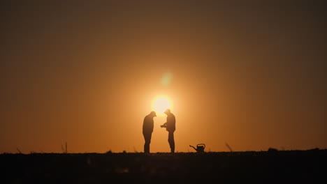 farmers at sunset