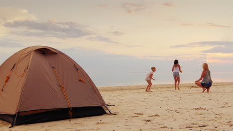 Mother-Plays-With-Two-Daughters-Blow-Bubbles-In-The-Foreground-Stands-A-Tent-A-Great-Holiday-In-Natu
