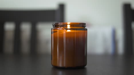 cinematic shot of a candle being blown out