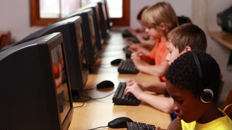 row of pupils working in computer class