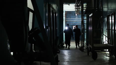 female safety guards with flashlight in a warehouse