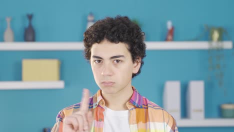boy says no to the camera, no.