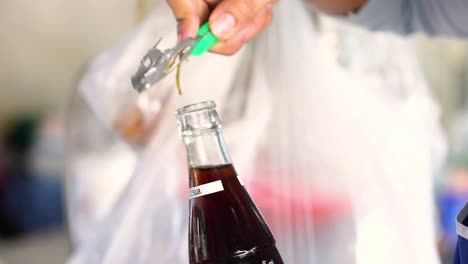 sequence of opening a soda bottle causing eruption