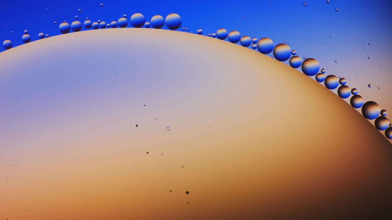 Colorful artistic of oil drop floating on the water.